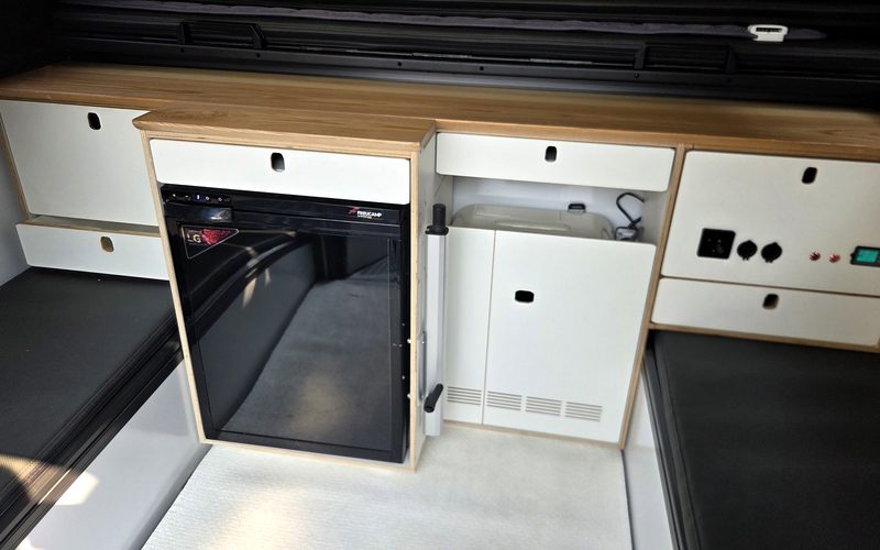 Upper module cabinet with refrigerator and power panel
