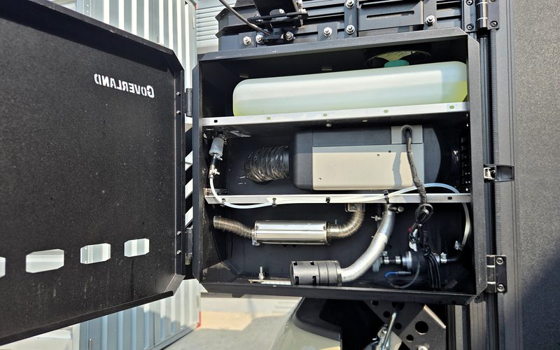 Heater box opened — diesel parking heater and fuel tank