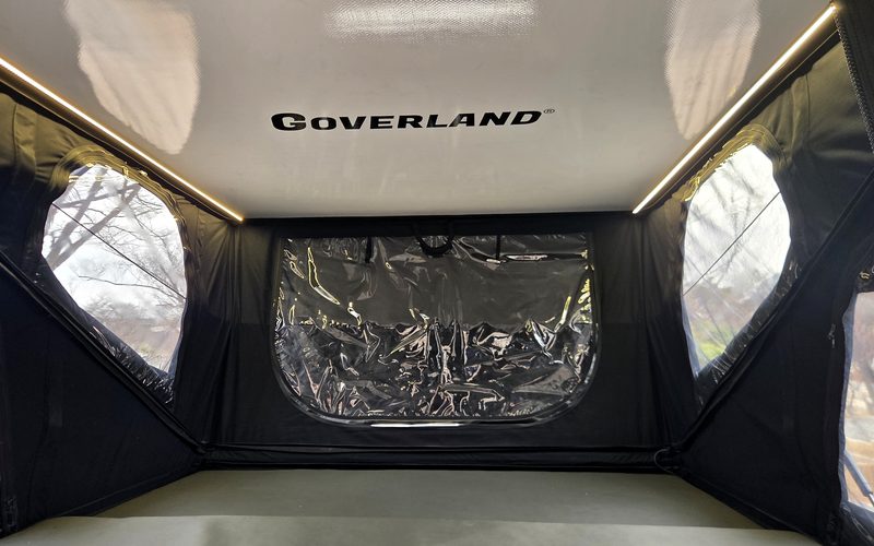 GOAT interior with the tent up — LED strips along both sides of the ceiling, and the windows