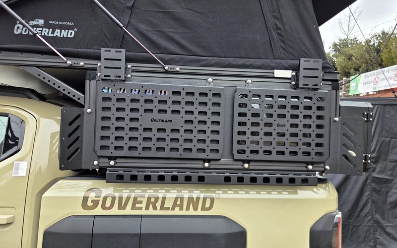 MOLLE panel on the exterior rail along the camper side